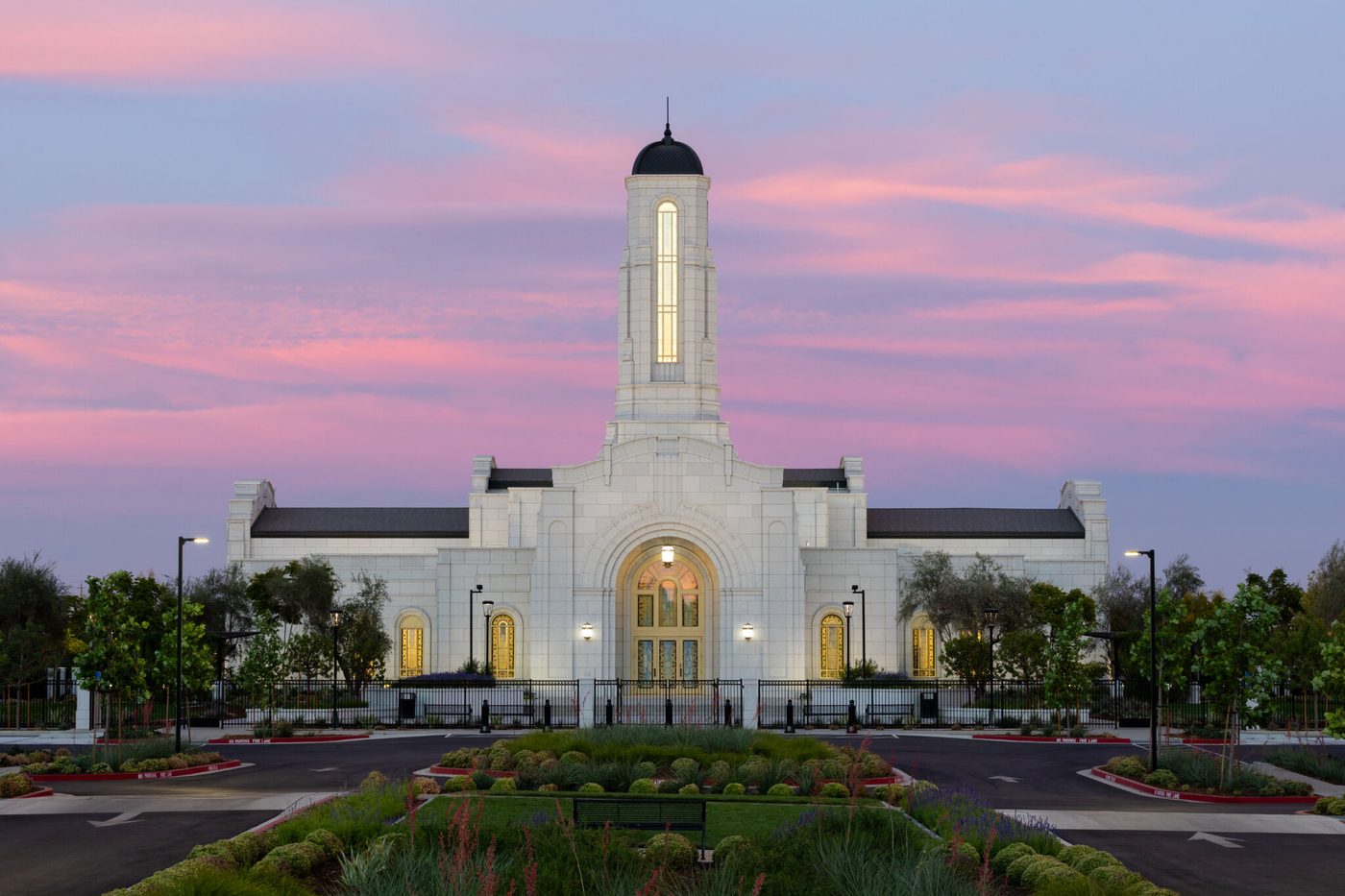 The Modesto California Temple glowing at dusk